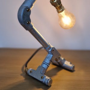 Unique Steampunk industrial lamp, perfect for modern home decor, featuring galvanized steel, brass. Steampunk decor style
