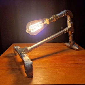 Mechanical style steampunk inspired industrial lamp made from galvanised steel pipe