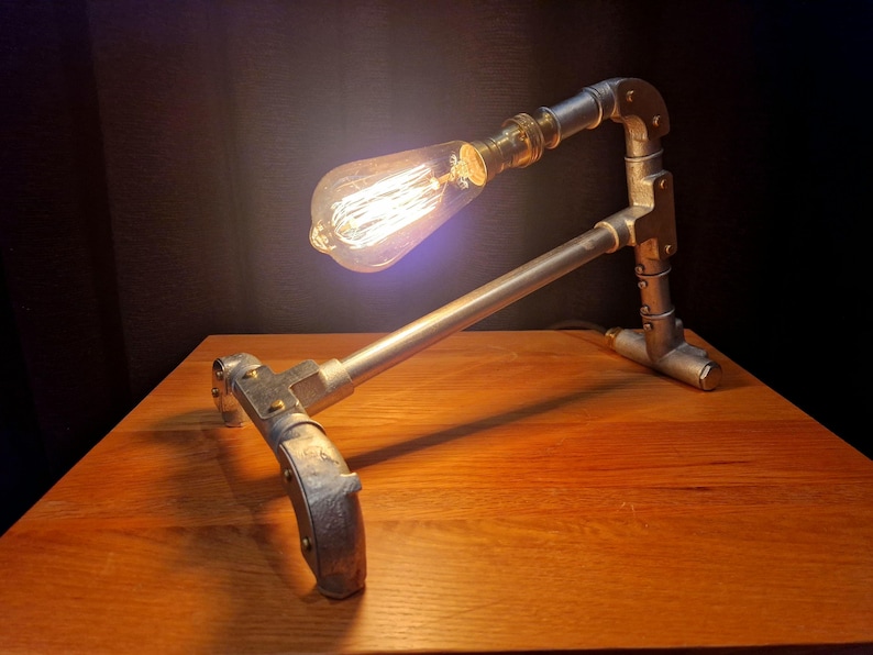 Mechanical style steampunk inspired industrial lamp made from galvanised steel pipe