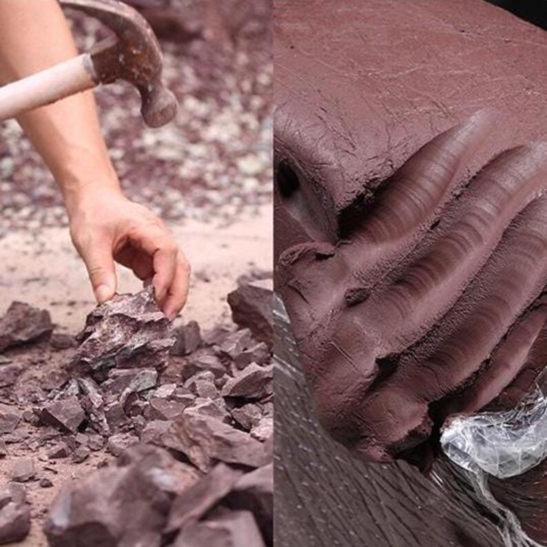 May include: A person's hand using a hammer to break apart reddish-brown rocks. The image also shows a large block of the same material, possibly clay or stone, with visible texture and a plastic wrap.