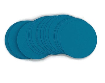 May include: A stack of teal blue paper circles. The circles are arranged in a semi-circle shape.