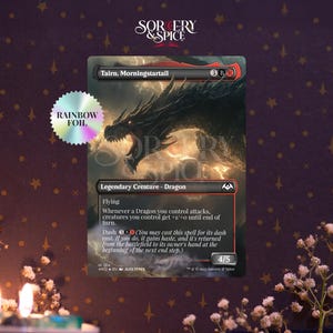 May include: A collectible card featuring a black dragon illustration with the text "Tairn, Morningstartail." The card is labeled "Legendary Creature - Dragon" and includes game text. A rainbow foil sticker is on the left.