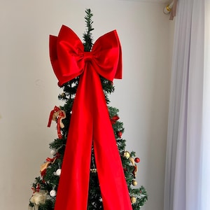 Röd juldekorationsrosett