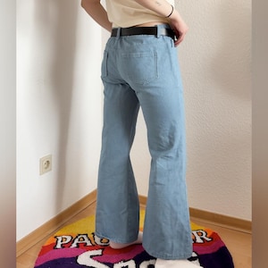 May include: A set of three ceramic mugs with a speckled, matte finish in cream, light grey, and dark grey. Each mug has a simple, minimalist design, ideal for coffee or tea.