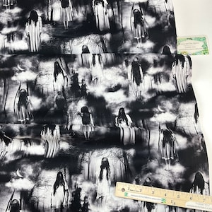 May include: Black and white fabric with a repeating pattern of spectral figures in a misty forest. The design includes tree silhouettes, clouds, and crescent moons, creating a spooky, Halloween-themed aesthetic. Suitable for various craft projects, the fabric is sold by the metre.