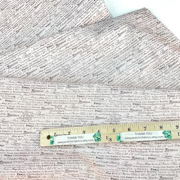 Script on Light Pink Background, 100% Quilting Cotton Fabric ~ Parisian Snippets Collection by Frank Garcia for Blank Quilting