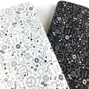May include: Two fabric samples, one white and one black, are covered in math symbols, equations, and the phrase "I ❤️ MATH." Geometric shapes, numbers, and mathematical operators create a repeating pattern. The fabric is suitable for crafting or educational projects.