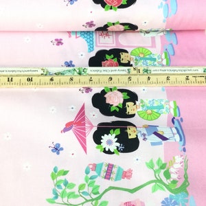 May include: Pink fabric with a repeating pattern of Japanese geishas, flowers, and lanterns. The design includes geishas with black hair, holding fans and umbrellas. The fabric is decorated with butterflies and small white flowers.