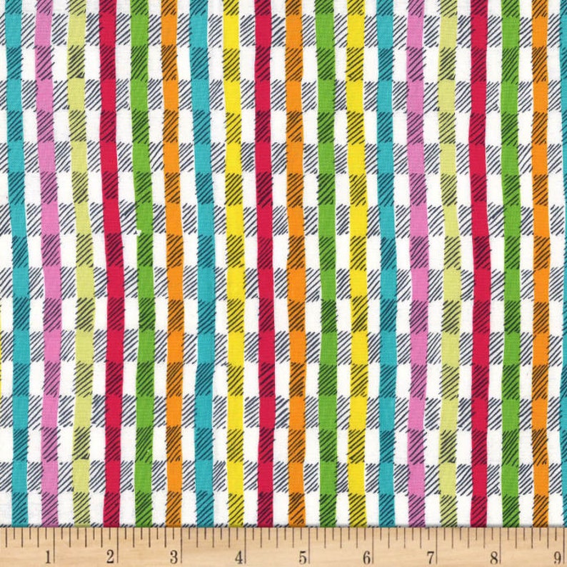 May include: A colorful fabric with a white background featuring a plaid pattern overlaid with vertical stripes in various colors. The stripes include red, orange, yellow, green, blue, and pink. The fabric is measured in inches.