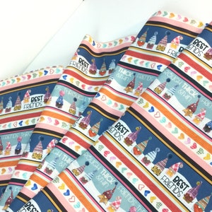 May include: Fabric with a repeating pattern of gnomes, hearts, and stripes in blue, red, orange, and pink. The text "BEST FRIENDS" and "ROUGH THICK & THIN" are also visible on the fabric.
