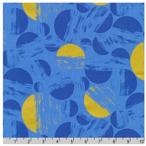 May include: Blue fabric with a pattern of overlapping blue and yellow circles. The circles have a textured, brushstroke-like appearance. The fabric is measured in inches.