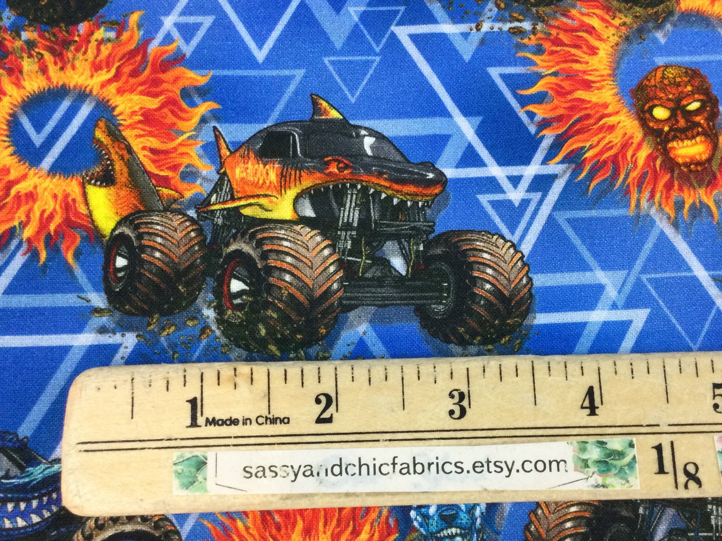 Large Monster Jam Trucks Fire Fabric by Sykel Enterprises - modeS4u