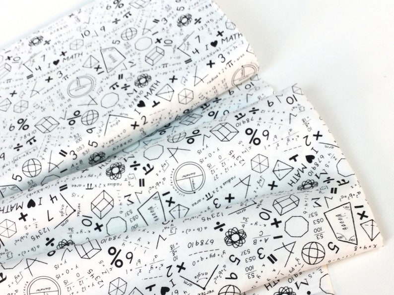 May include: White fabric printed with black math symbols, equations, and the text "I &hearts; MATH". Geometric shapes, numbers, and mathematical operators cover the fabric. The fabric is folded, showing multiple layers.