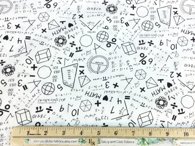 May include: White fabric with a repeating pattern of black math symbols, equations, and geometric shapes. Includes the text "I ❤️ MATH". A ruler in inches is at the bottom. Great for math enthusiasts.