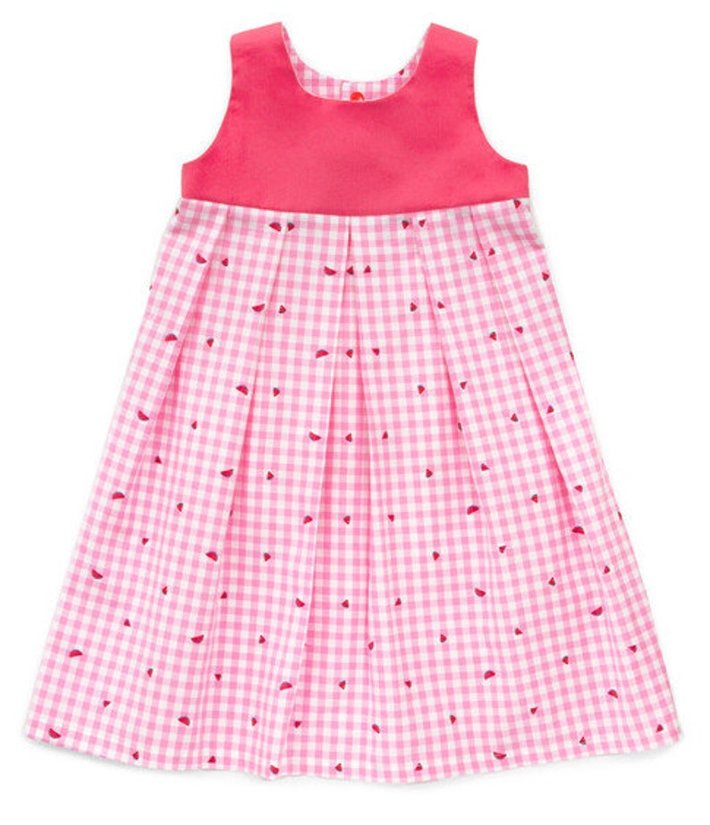 May include: A sleeveless pink dress with a gingham pattern and red watermelon slice accents. The bodice is a solid pink, and the skirt features pleats. The dress is designed for children.
