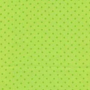 May include: Bright green fabric with a repeating pattern of darker green polka dots. The fabric has a textured appearance, and the dots are evenly spaced across the surface. This textile is suitable for various craft projects.