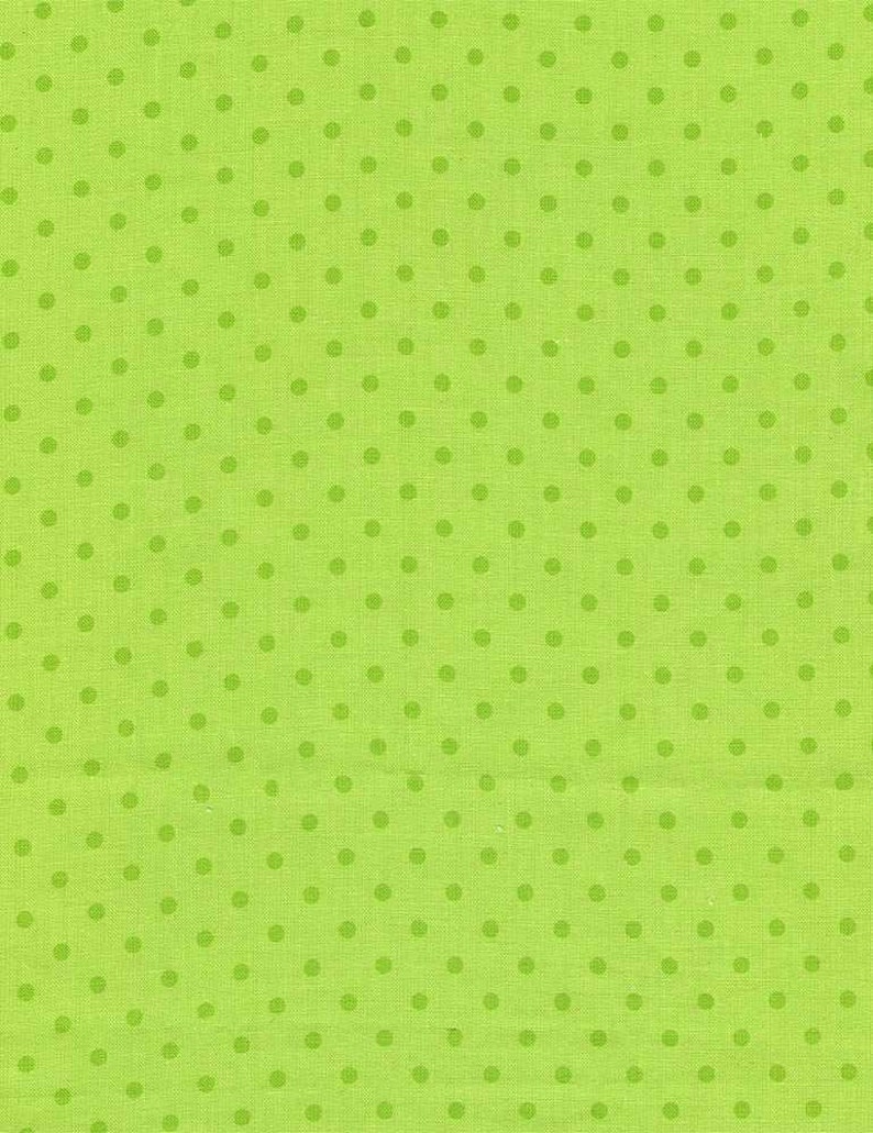 May include: Bright green fabric with a repeating pattern of darker green polka dots. The fabric has a textured appearance, and the dots are evenly spaced across the surface. This textile is suitable for various craft projects.