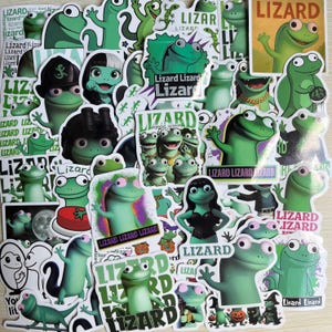May include: A collection of assorted vinyl stickers featuring various cartoon green lizards in different outfits and poses. Many stickers include the word Lizard in bold text, with some designs showing lizards wearing hats, jewellery, or costumes.