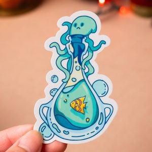 May include: A blue and yellow cartoon sticker of an octopus trapped inside a bottle with a single yellow fish swimming inside. The octopus has a sad expression on its face.