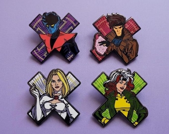 May include: Four enamel pins shaped like the letter X, each featuring a different comic book character. The top left shows a blue-skinned character in red, the top right a brown-clad figure, the bottom left a blonde in white, and the bottom right a character with white-streaked hair in a green jacket.