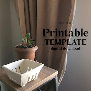 May include: A square, white ceramic basket with vertical cutouts sits on a wooden table. A small potted plant is behind the basket. The image includes the text "Printable TEMPLATE + digital download."