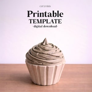 May include: A concrete cupcake sculpture with a textured, swirled frosting design. The cupcake base is a light beige color, and the frosting is a darker gray with black specks. The text "Printable TEMPLATE - digital download -" is at the top.