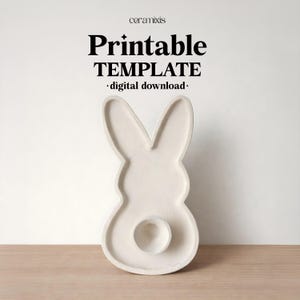 May include: A white ceramic bunny-shaped template with a circular indentation. The template has long ears and a rounded body. The text "Printable TEMPLATE • digital download •" is at the top.