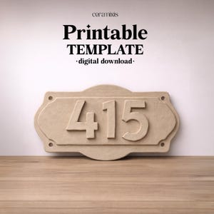 May include: A beige address plaque with the number 415 in bold, raised numerals. The plaque has a decorative shape with rounded edges and four pre-drilled holes. The words "Printable TEMPLATE - digital download -" are printed above the plaque.