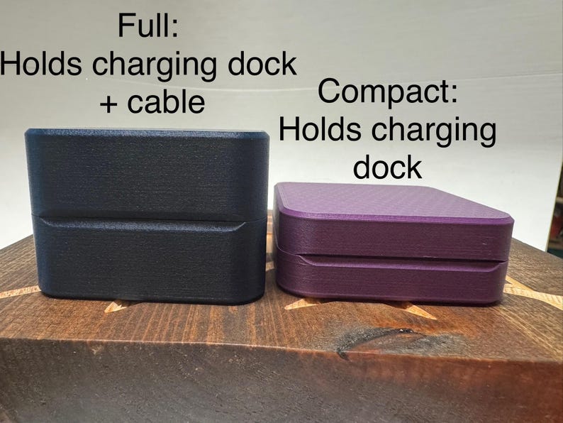 May include: Two storage boxes for charging docks. The box on the left is black and labelled "Full: Holds charging dock + cable". The box on the right is purple and labelled "Compact: Holds charging dock".