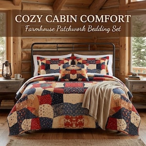 May include: A patchwork bedding set featuring a quilt and two pillows with a red, navy blue, and cream floral pattern. The set is displayed on a bed with a dark metal frame. The text COZY CABIN COMFORT Farmhouse Patchwork Bedding Set is visible.