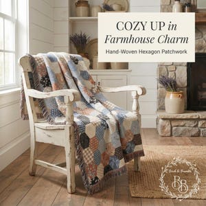 May include: A throw blanket featuring a hand-woven hexagon patchwork pattern in muted blue, brown, and cream tones with fringed edges, draped over a white wooden chair. The text reads: COZY UP in Farmhouse Charm Hand-Woven Hexagon Patchwork.