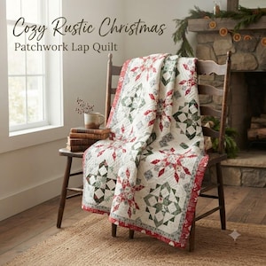 May include: A patchwork lap quilt featuring a repeating star pattern in shades of red, green, and white, draped over a wooden chair. The quilt has a white background with intricate stitching and a red border. Text reads: Cozy Rustic Christmas Patchwork Lap Quilt.
