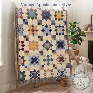 May include: A woven throw blanket featuring a repeating star pattern in shades of blue, yellow, red, and green on a cream background. The text "Vintage Appalachian-Style" is printed at the top, and the blanket has a fringed edge finish.