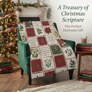 May include: A quilted throw blanket featuring a grid pattern of Christmas-themed squares, including illustrations of poinsettias, holly, and berries, interspersed with blocks of text containing various Bible verses in a serif font.