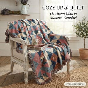 May include: A woven throw blanket with a triangular patchwork pattern in shades of blue, red, and cream, draped over a white wooden armchair. The text COZY UP & QUILT Heirloom Charm, Modern Comfort is visible at the top, with #FARMHOUSESTYLE at the bottom.