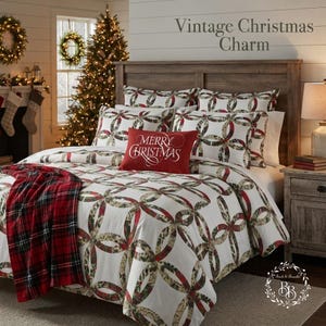 May include: A bedding set featuring a white duvet cover and pillow shams with a repeating interlocking ring pattern in red, green, and tan. A rectangular red accent pillow with the white text Merry Christmas is centered on the bed.