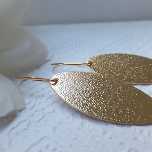 Gold Brushed Oval Pendant Earrings on nickel free tall french gold plated hooks