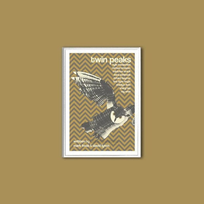 May include: A vintage poster for the television show "Twin Peaks" featuring a black and white illustration of an owl against a yellow and brown chevron pattern. The poster lists the cast members and credits the show's creators, Mark Frost and David Lynch.