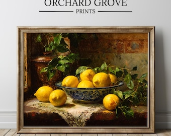 May include: Framed print of a still life featuring a bowl of lemons. The bowl is blue and white, surrounded by greenery and additional lemons. The print is labeled "ORCHARD GROVE PRINTS".