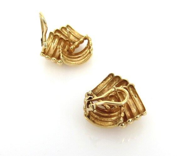 Gold love knot earrings - image 4