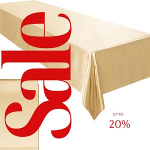 Puede incluir: Un mantel de satén dorado con un gráfico rojo de "Venta" y el texto "Hasta un 20%".