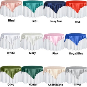 May include: Twelve square tablecloths in various colors, including blush, teal, navy blue, red, white, ivory, pink, royal blue, olive, hunter green, champagne, and silver. The tablecloths are made of satin and are displayed on white tables.