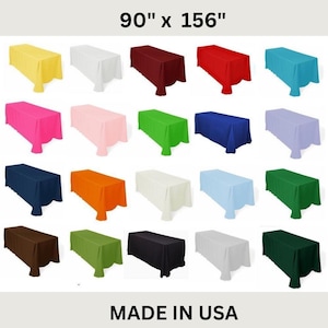 May include: A selection of rectangular tablecloths in various colours, including yellow, white, burgundy, red, teal, pink, light pink, green, blue, lavender, navy, orange, cream, light blue, and dark green. The dimensions are 228.6 cm x 396.24 cm. Made in the USA.