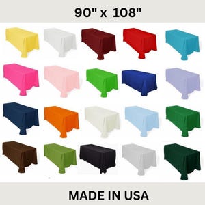 May include: A collection of rectangular tablecloths in various colors, including yellow, white, burgundy, red, teal, pink, light pink, green, blue, lavender, navy, orange, cream, light blue, and dark green. The dimensions are 90" x 108". The text "MADE IN USA" is at the bottom.