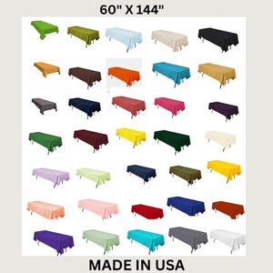 May include: A variety of rectangular tablecloths in various colors, including green, blue, orange, and black. The dimensions are 60" x 144". The text "MADE IN USA" is at the bottom.
