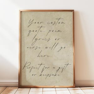 May include: A framed print with a light brown background and handwritten black text. The text reads "Your custom quote, poem, lyrics or verse will go here. Perfect for a gift or keepsake."