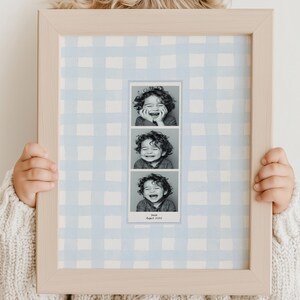 A customizable Photo Booth template, a Photo Booth strip on a blue watercolor gingham background hanging in a boys nursery or kids room.