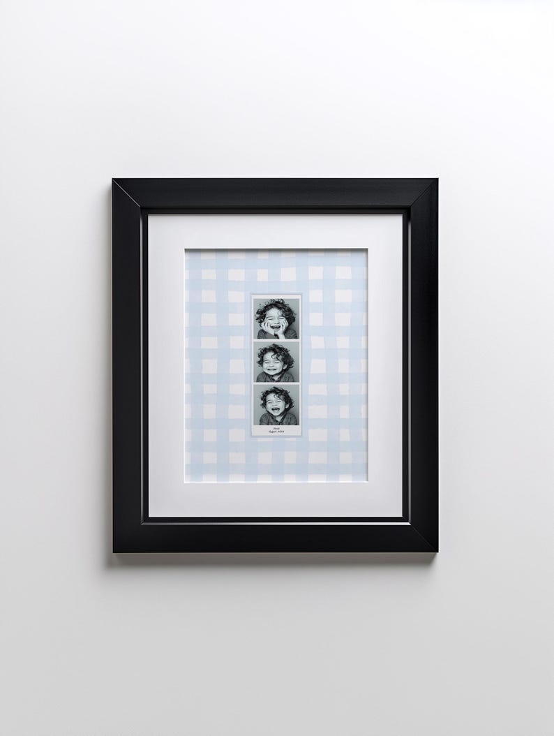 A customizable Photo Booth template, a Photo Booth strip on a blue watercolor gingham background hanging in a boys nursery or kids room.