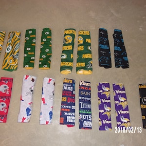 Pair Seat Belt Protectors (Green Bay Packers,  Boston Red Sox, Carolina Panthers, New England Patriots, NFL teams, or Minesota Vikings)