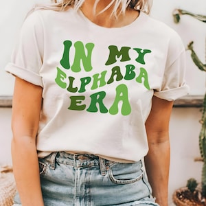 In my elphaba era T-shirt, wicked shirt, musical lovers shirt, wicked movie shirt, cute wicked shirt, witch shirt, wicked broadway shirt